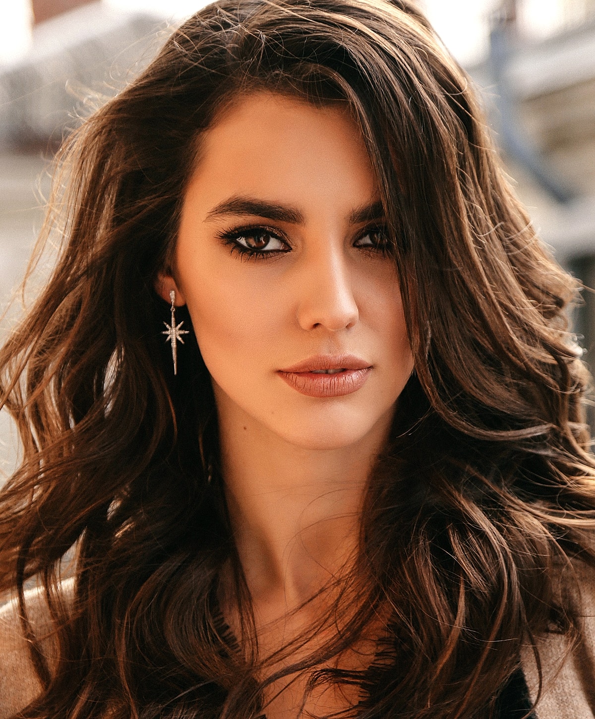 Close-up of a woman with wavy hair.