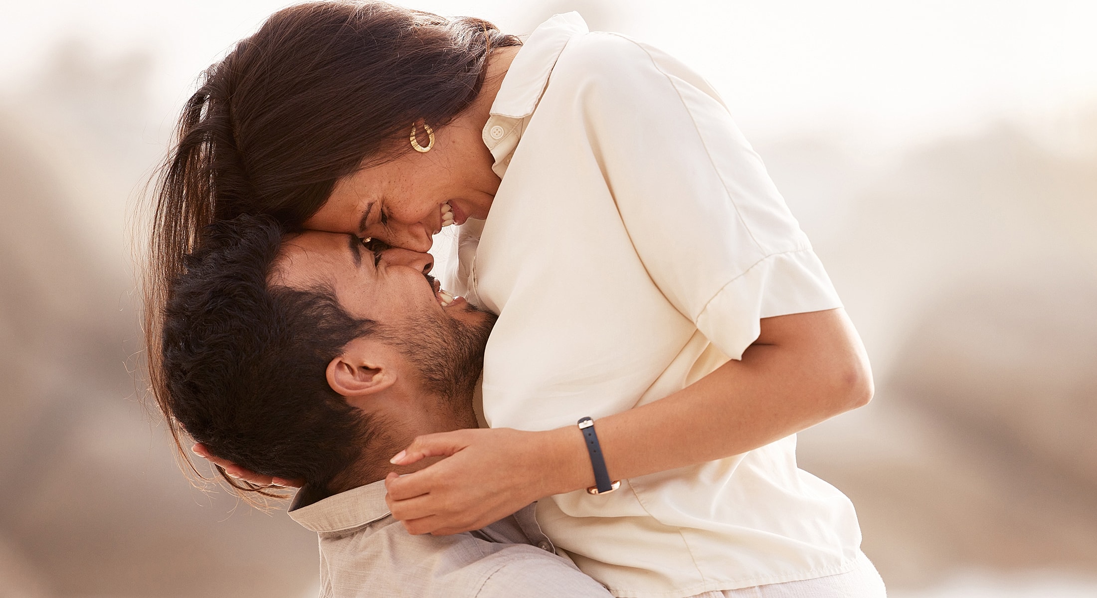 Couple embracing and sharing a joyful moment.