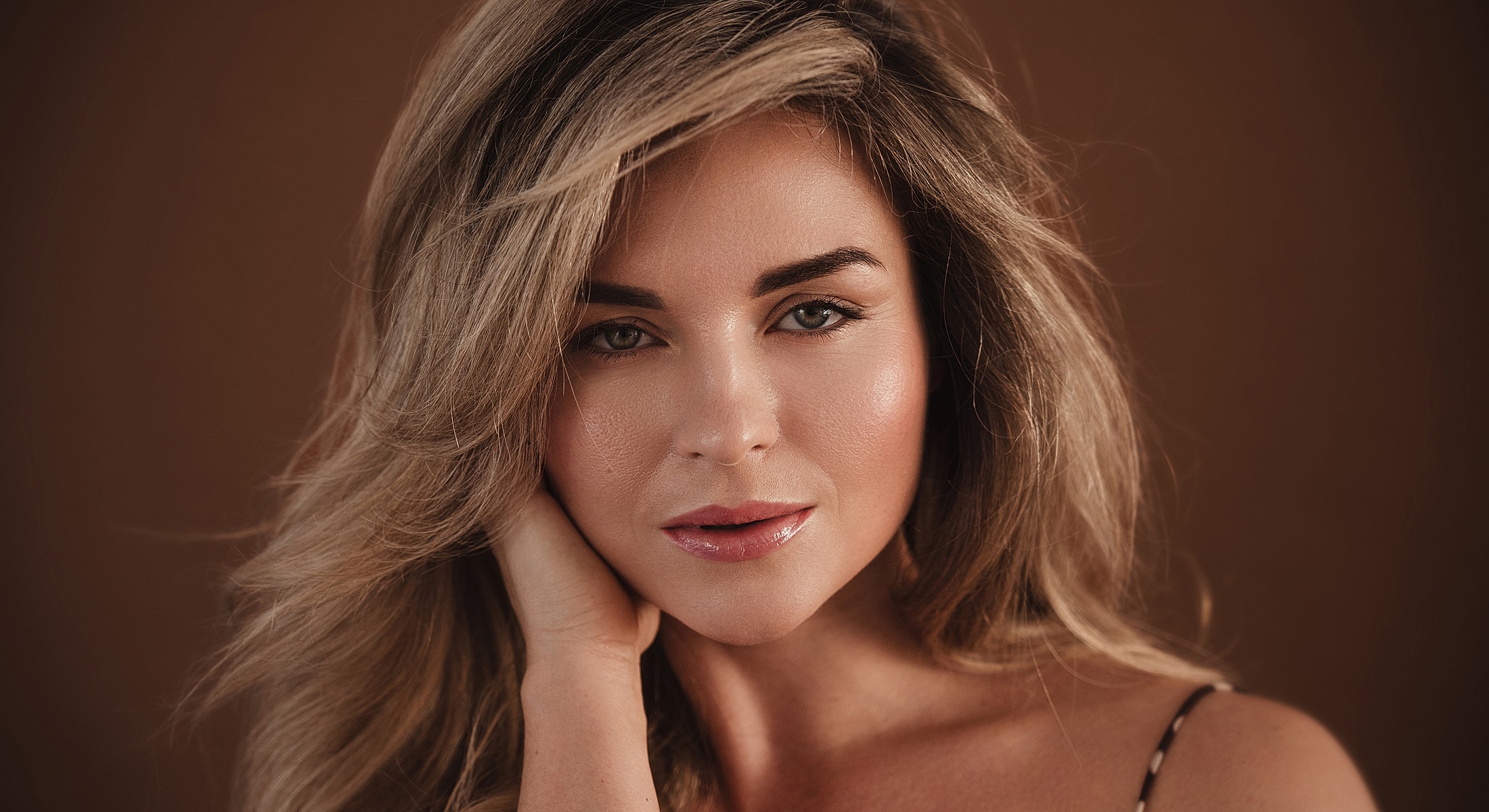 Portrait of a woman with flowing hair.